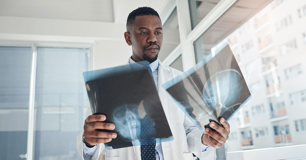 doctor looking at x-rays